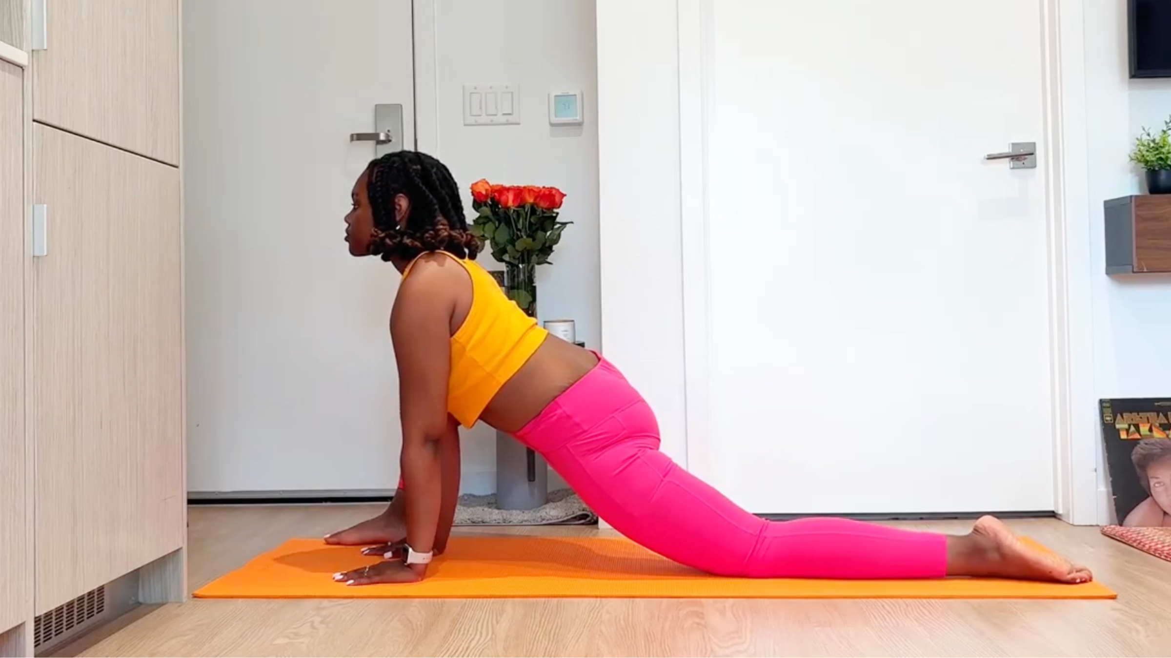 Yoga teacher practicing Lizard Pose
